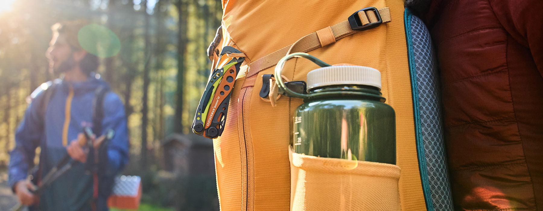 Leatherman clipped to a hiking pack at camp
