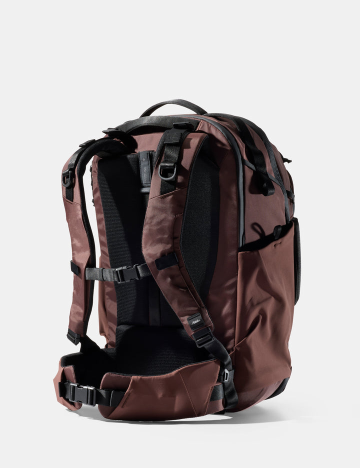 Matador 35L Global Travel Pack in Garnet - garnet backpack with black straps on a white background