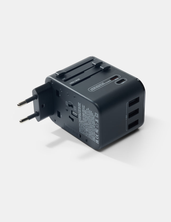 Matador Global Travel Adapter in Black - black travel adapter on a white background