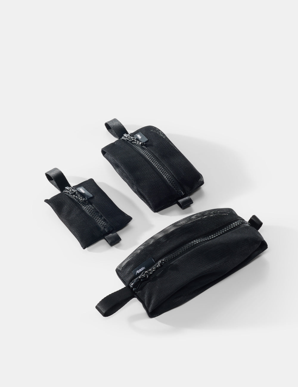 Matador Mesh Organizer Bag Set (3-Pack) - three black pouches of varying sizes on a white background