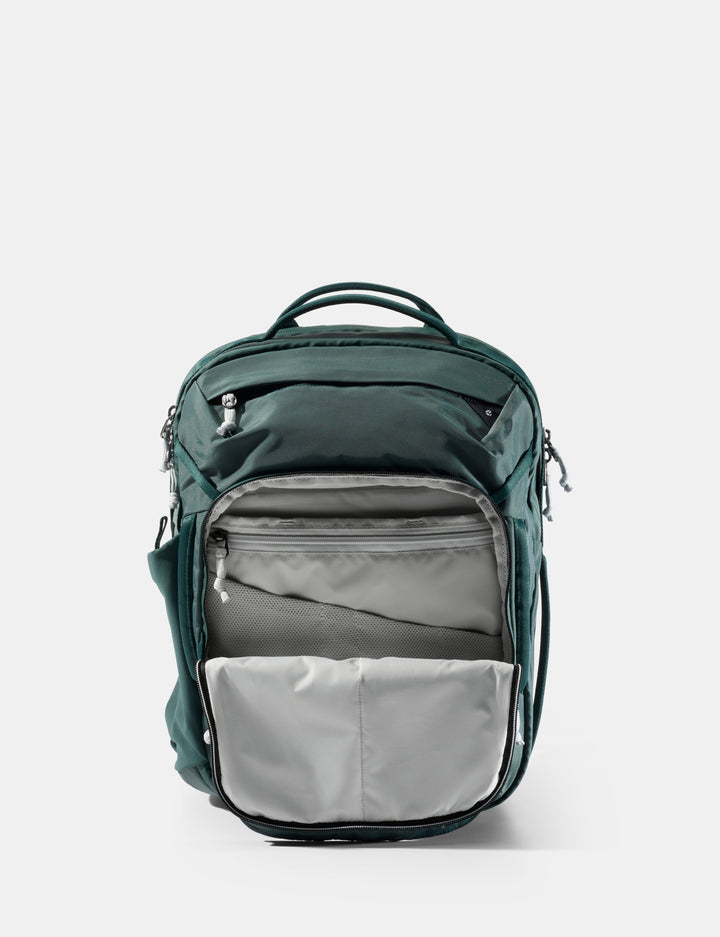 Matador 18L Personal Item Travel Pack in Juniper - green backpack with gray interior on a white background