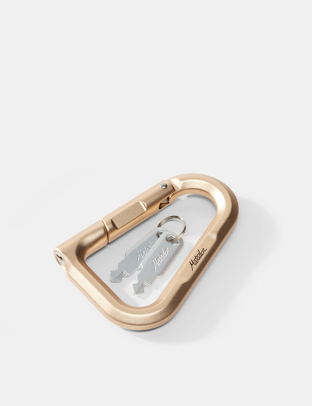 Matador BetaLock in Gold - gold carabiner with a keychain on a white background