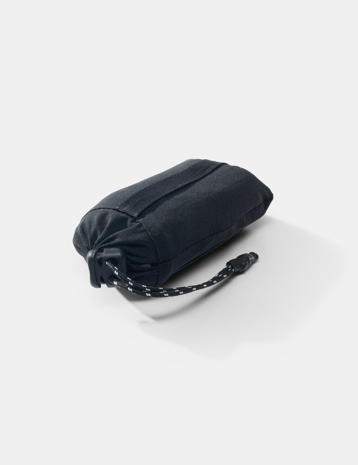 Matador Mini Pocket Blanket™ 4.0 - 110 x 70cm in Blue - black folded bag with a strap on a white background