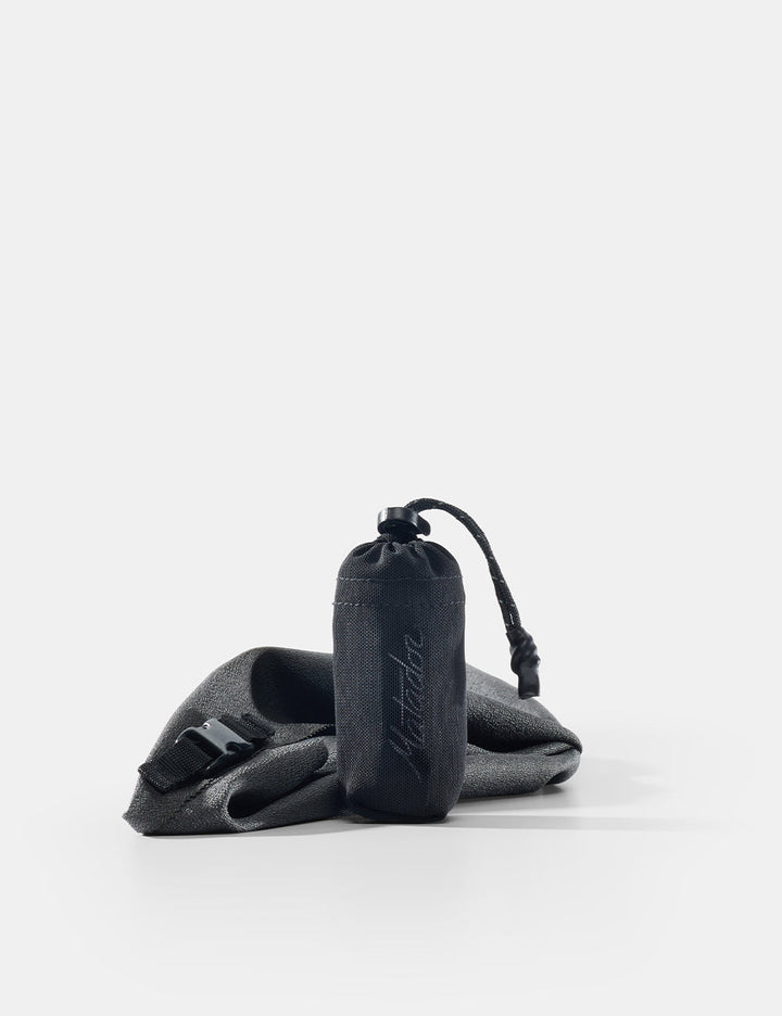 Matador Ultralight Travel Towel - Small 39 x 39cm - gray towel and pouch on a white background