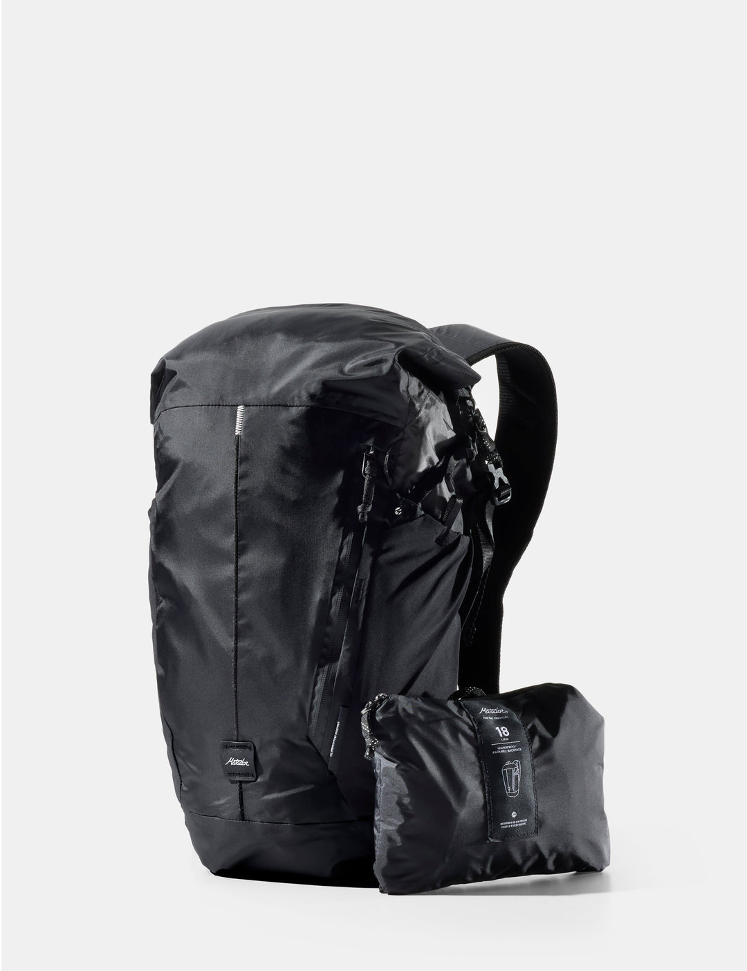 Matador 18L Waterproof Packable Backpack in Black - black backpack with a smaller black pack attached on a white background