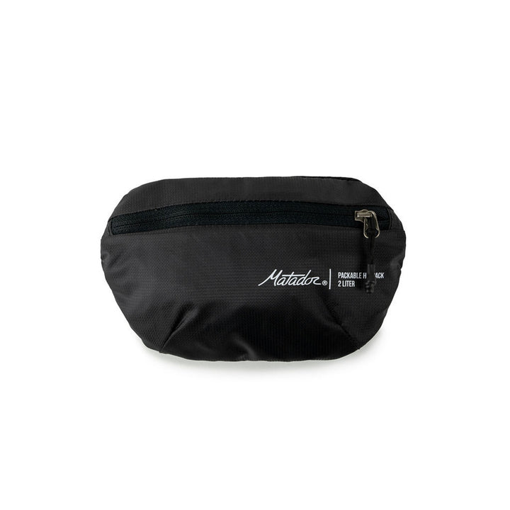 Matador On-Grid Packable Hip Pack folded to its 2L stuff pocket