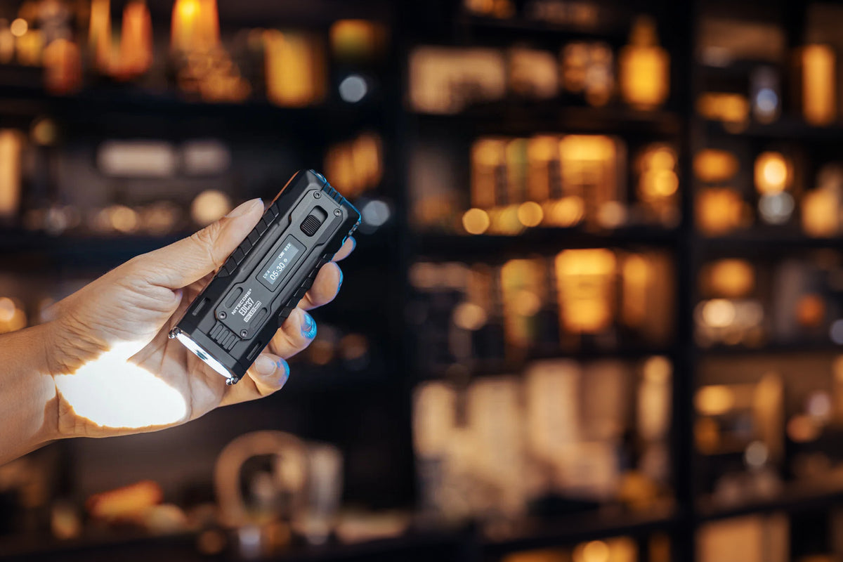 EDC37 flashlight held in hand, wide homepage hero